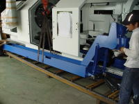 An Annn Yang DY-1200 x 2000 being lower onto a steel shipping skid
